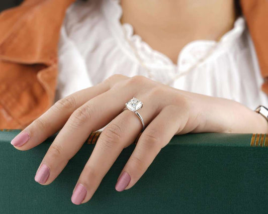 Diamond engagement ring on a woman's hand.