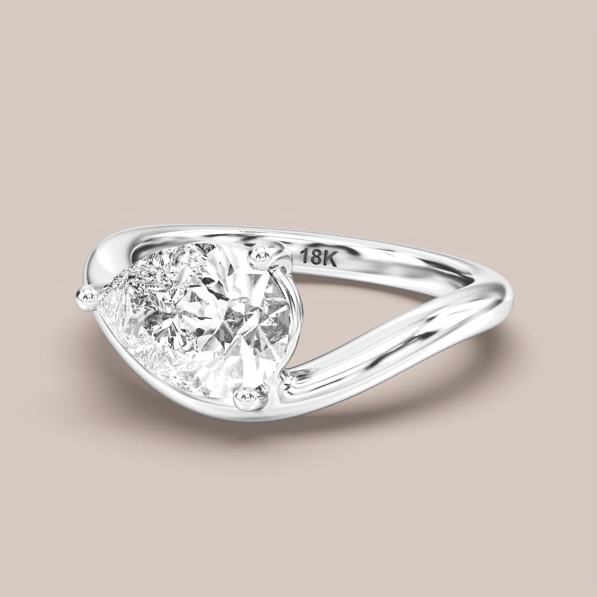 V05 Free Form Bypass in 18K white gold with a pear diamond