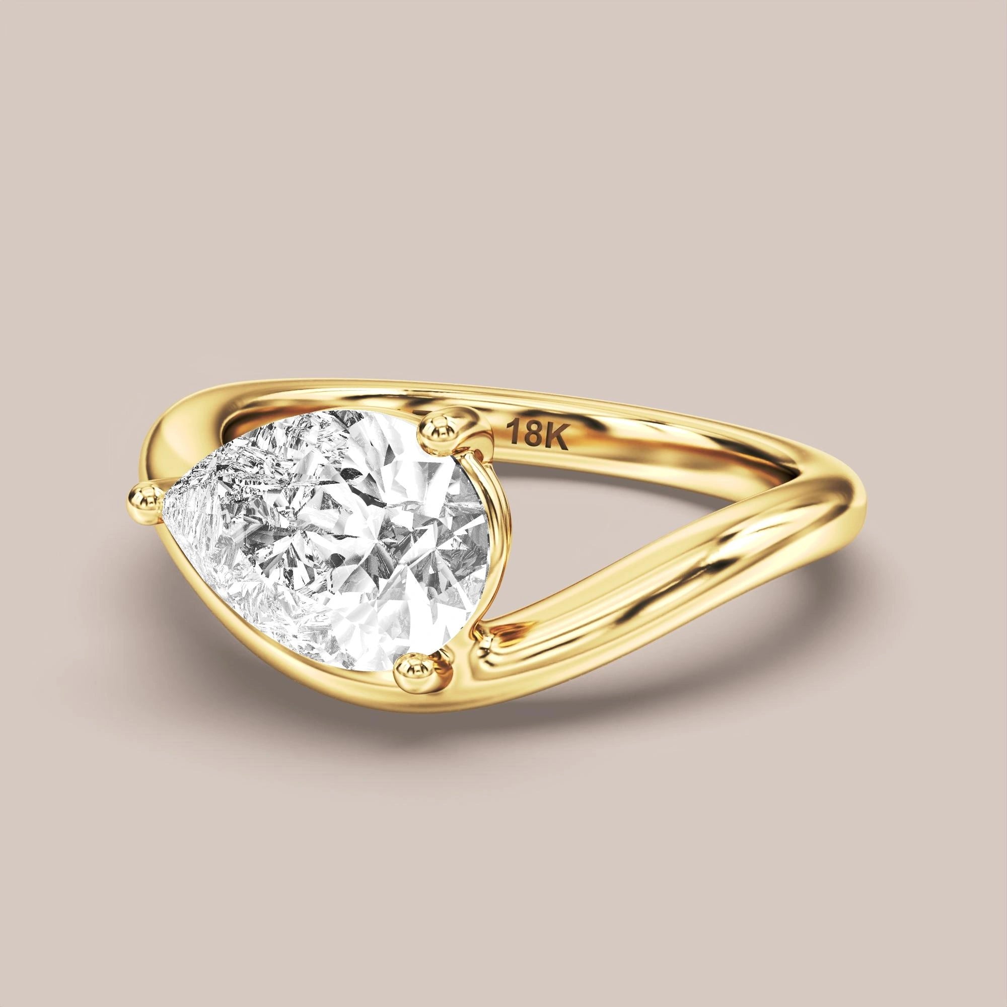 V05 Free Form Bypass in 18K yellow gold with a pear diamond