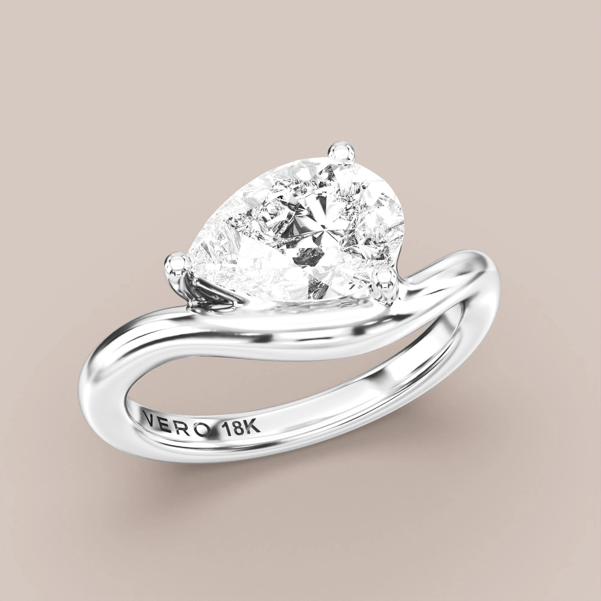 V05 Free Form Bypass in 18K white gold with a pear diamond
