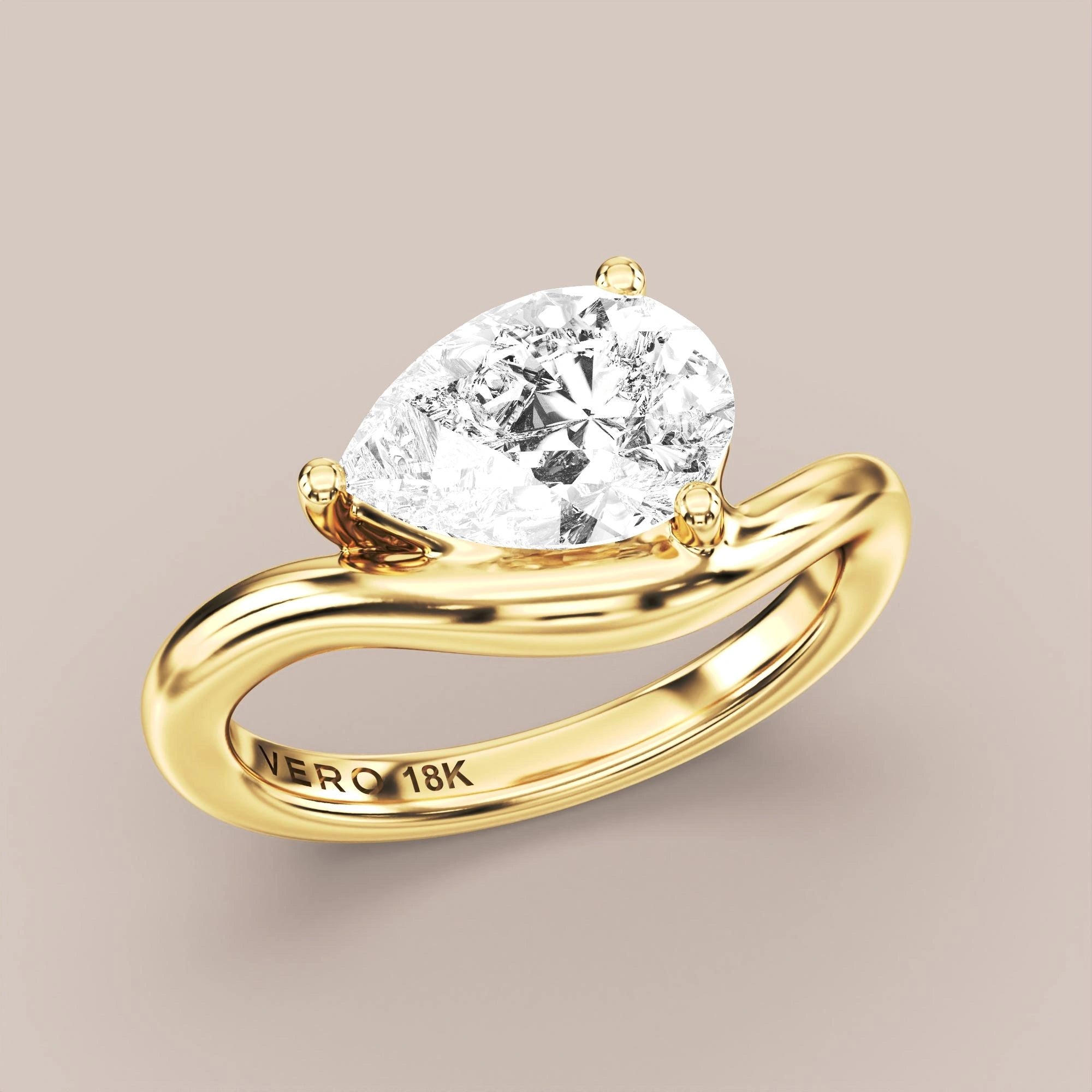 V05 Free Form Bypass in 18K yellow gold with a pear diamond