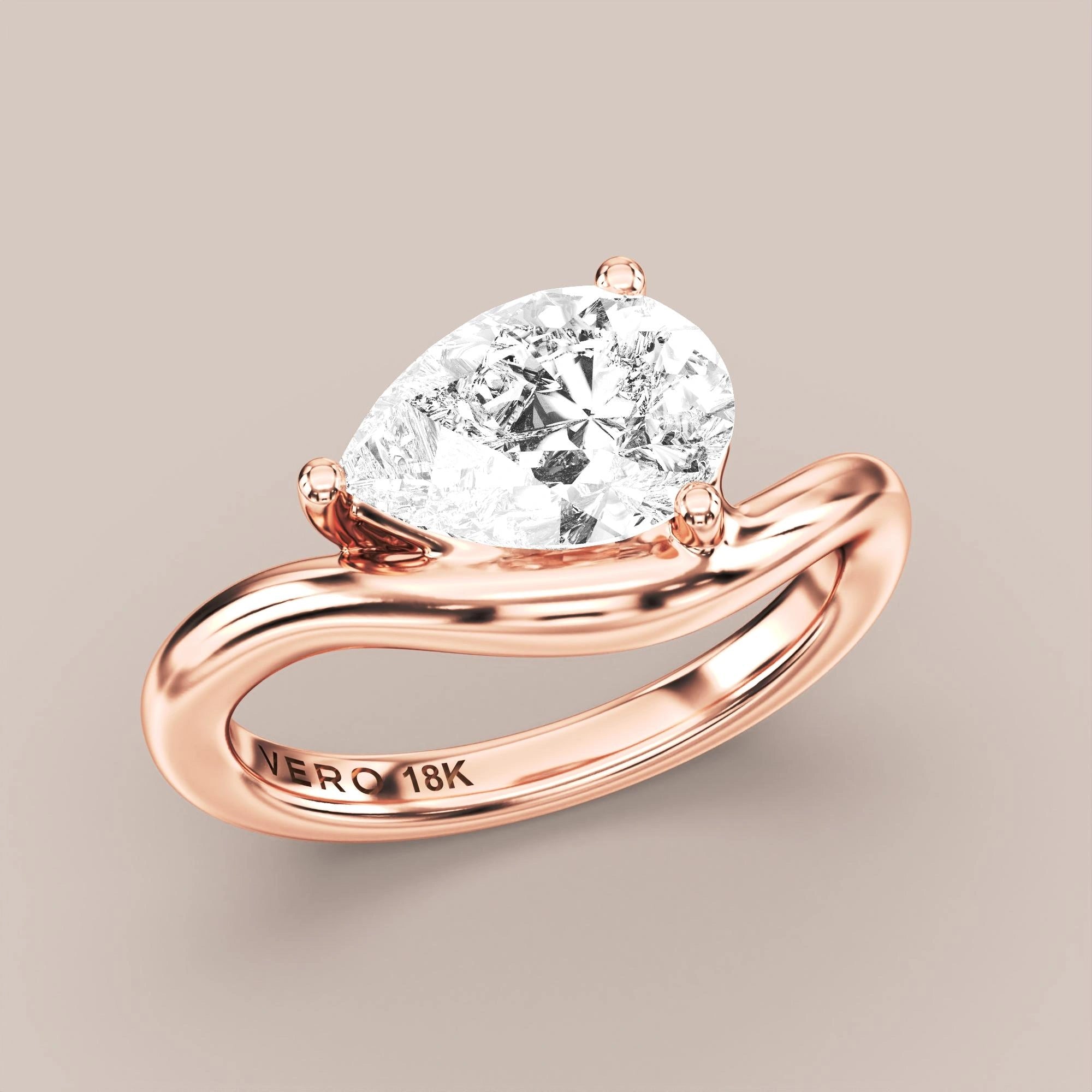 V05 Free Form Bypass in 18K rose gold with a pear diamond