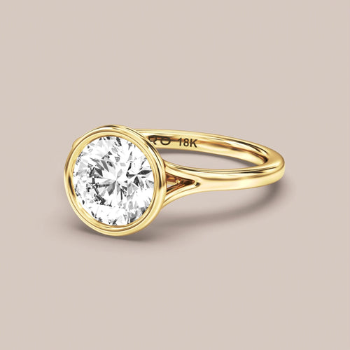 Cathedral Split Shank Bezel Set engagement ring in 18K yellow gold