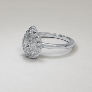 18 Karat White Gold Pear Shape Brilliant Cut Diamond Halo Engagement Ring with Dainty Shank